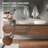 A modern bathroom vanity with two sinks, featuring wooden cabinets and a large round mirror. The image highlights the flooring with text overlays describing its features. Náhled obrázku produktu