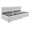 A light gray upholstered bed frame with a slatted mattress support is shown against a white background. The bed frame has a tufted design on its sides and a tall, straight headboard. The mattress support is visible, indicating it is a bed frame without a m Produktbild-Vorschau