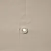 A close-up view of a cream-colored fabric with a grommet. Produktbild-Vorschau