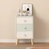 A children's dresser with decorative items on top, set against a plain wall. Anteprima dell’immagine prodotto