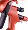 A close-up view of an orange and black spray gun. Náhled obrázku produktu