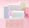 A collage of three different colored Bluetooth keyboards displayed on a pink and white background with marketing text and icons at the bottom. Náhled obrázku produktu