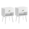 Two white mid-century modern nightstands with gold knobs are shown against a white background. Produktbild-Vorschau