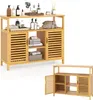 A bamboo bathroom cabinet with slatted doors and open shelves, displaying towels and toiletries. Podgląd zdjęcia produktu