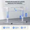 An image showing a white standing desk frame with height adjustment indicators. Podgląd zdjęcia produktu
