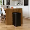 A modern kitchen with a wooden island and a black trash can. Produktbild-Vorschau
