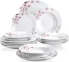 A collection of white porcelain dinnerware with a pink cherry blossom pattern. Produktbild-Vorschau