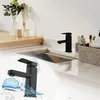 A black kitchen faucet is shown in a modern bathroom or kitchen setting, with a smaller inset image highlighting its features. Produktbild-Vorschau
