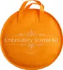 An orange circular bag with "Embroidery Starter Kit" written on it. Náhled obrázku produktu