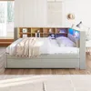 A bedroom scene with a bed and storage headboard. Produktbild-Vorschau