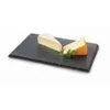 Two wedges of cheese and a sprig of parsley are presented on a dark slate serving board against a white background. Náhled obrázku produktu