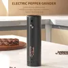 An electric pepper grinder is shown on a countertop next to a piece of steak. Náhľad obrázku produktu