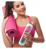 A woman holding a yoga mat and a water bottle. Náhľad obrázku produktu