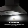 A close-up view of a black range hood with its LED lights illuminated, set against a dark background. Text overlays describe the product's features. Produktbild-Vorschau