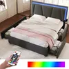 A bedroom scene featuring a bed with storage drawers and LED lighting, with a remote control in the foreground. Náhled obrázku produktu