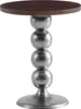 A round side table with a wooden top and a metallic base made of stacked spheres. Voir les images du produit