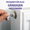 A hand is using a small metal key to adjust a valve on a white radiator. Text overlays the top of the image. Podgląd zdjęcia produktu