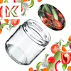 A clear glass jar is shown tilted on a white background, surrounded by various fresh vegetables and herbs, with a logo in the top left corner and a lid filled with vegetables in the top right. Produktbild-Vorschau