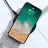 A smartphone is shown charging wirelessly on a charging pad, with a cable connected to the pad. Produktbild-Vorschau