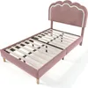 A single bed frame with a pink upholstered headboard and frame, shown from a diagonal angle against a white background. Produktbild-Vorschau