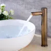 A faucet in a bathroom sink with water running. Podgląd zdjęcia produktu