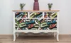 A dresser with drawers decorated with a cassette tape pattern, placed in a room. Náhled obrázku produktu