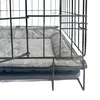 A close-up view of a dog crate with a gray mat inside. Náhled obrázku produktu