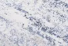 A close-up view of a rug with a distressed pattern. Náhled obrázku produktu