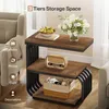 A three-tiered side table with decorative items on each shelf, placed in a living room setting. Produktbild-Vorschau