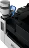 A close-up view of a toner bottle being inserted into a printer. Produktbild-Vorschau