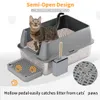 A cat is shown inside a semi-open litter box with a scoop and a litter mat. Náhľad obrázku produktu