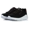 A pair of black Skechers Uno Lite sneakers with white soles and gold accents, presented against a white background. Voir les images du produit