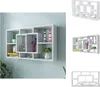 A white wall shelf with multiple compartments is mounted on a light blue wall. Voir les images du produit