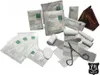 A collection of medical supplies, including bandages, gauze, and scissors, arranged on a white background. Produktbild-Vorschau