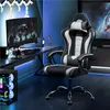 A gaming chair is set up in a modern gaming room with a computer desk, monitor, and PC. Produktbild-Vorschau