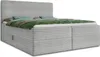 A grey corduroy box spring bed with green and blue bedding, shown from a diagonal angle against a white background. Produktbild-Vorschau