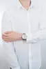 A person wearing a white shirt and a watch. Náhľad obrázku produktu