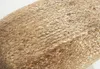 A close-up view of a woven jute pouf. Produktbild-Vorschau