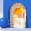 A bottle of essence Drop of Sunshine highlighter is displayed with a blue sphere and a sun graphic in the background. Voir les images du produit