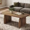 A living room scene with a coffee table, sofa, and rug. Anteprima dell’immagine prodotto