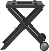 A black folding grill stand with wheels, shown from the side. Náhľad obrázku produktu