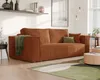 A modern living room with a corduroy sofa, coffee table, and rug. Produktbild-Vorschau