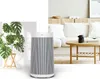 A collage showing an air purifier next to a plant and a living room scene with a sofa and coffee table. Anteprima dell’immagine prodotto