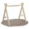 A wooden baby gym with hanging toys and a play mat. Náhled obrázku produktu