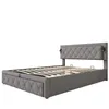 A gray upholstered bed frame with a tufted headboard and wooden slats for a mattress, shown against a white background. Produktbild-Vorschau