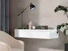 A modern living room setting with a floating shelf, a lamp, and a plant. Náhled obrázku produktu