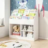 A white bookshelf filled with children's books and toys, set against a wall with a space-themed mural. Náhled obrázku produktu