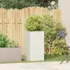 A garden scene with planters, a fence, and a chair. Podgląd zdjęcia produktu