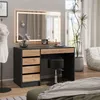 A vanity table with a mirror and stool in a bedroom setting. Produktbild-Vorschau