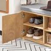 A shoe cabinet with a bench seat, showing the inside of one of the compartments with shoes and a basket. Produktbild-Vorschau